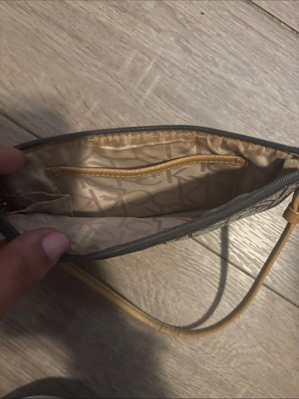 Calvin Klein Monogram Wristlet in Black and Tan